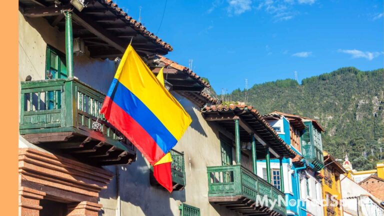 Image of Colombia Flag hanging from a home.